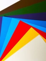 High-gloss specialty paper sheet with smooth reflective finish.