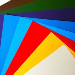 High-gloss specialty paper sheet with smooth reflective finish.