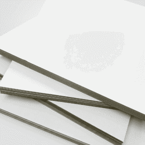 Duplex Board with Grey Back stacked in multiple formats for printing and carton production
