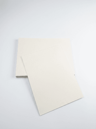 Premium SBS Paperboard sheets stacked in warehouse for luxury packaging and printing applications Premium SBS Paperboard sheets stacked in warehouse for luxury packaging and printing applications