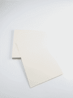 Premium SBS Paperboard sheets stacked in warehouse for luxury packaging and printing applications